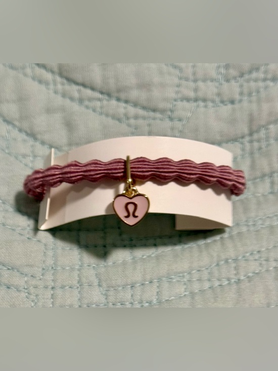 lululemon athletica Jewelry - lululemon, NWT, elastic hair tie or bracelet features Heart Charm lululemon logo